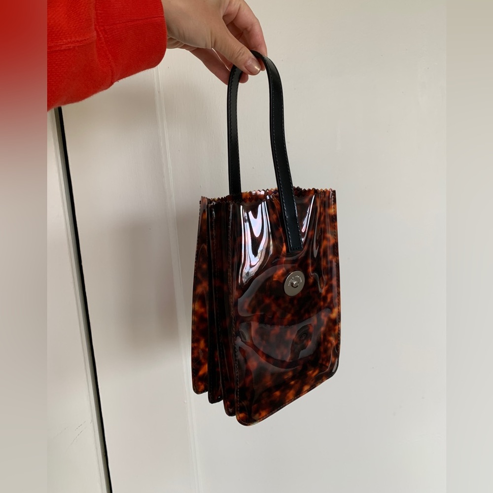 Kara tortoise pinch wristlet purse